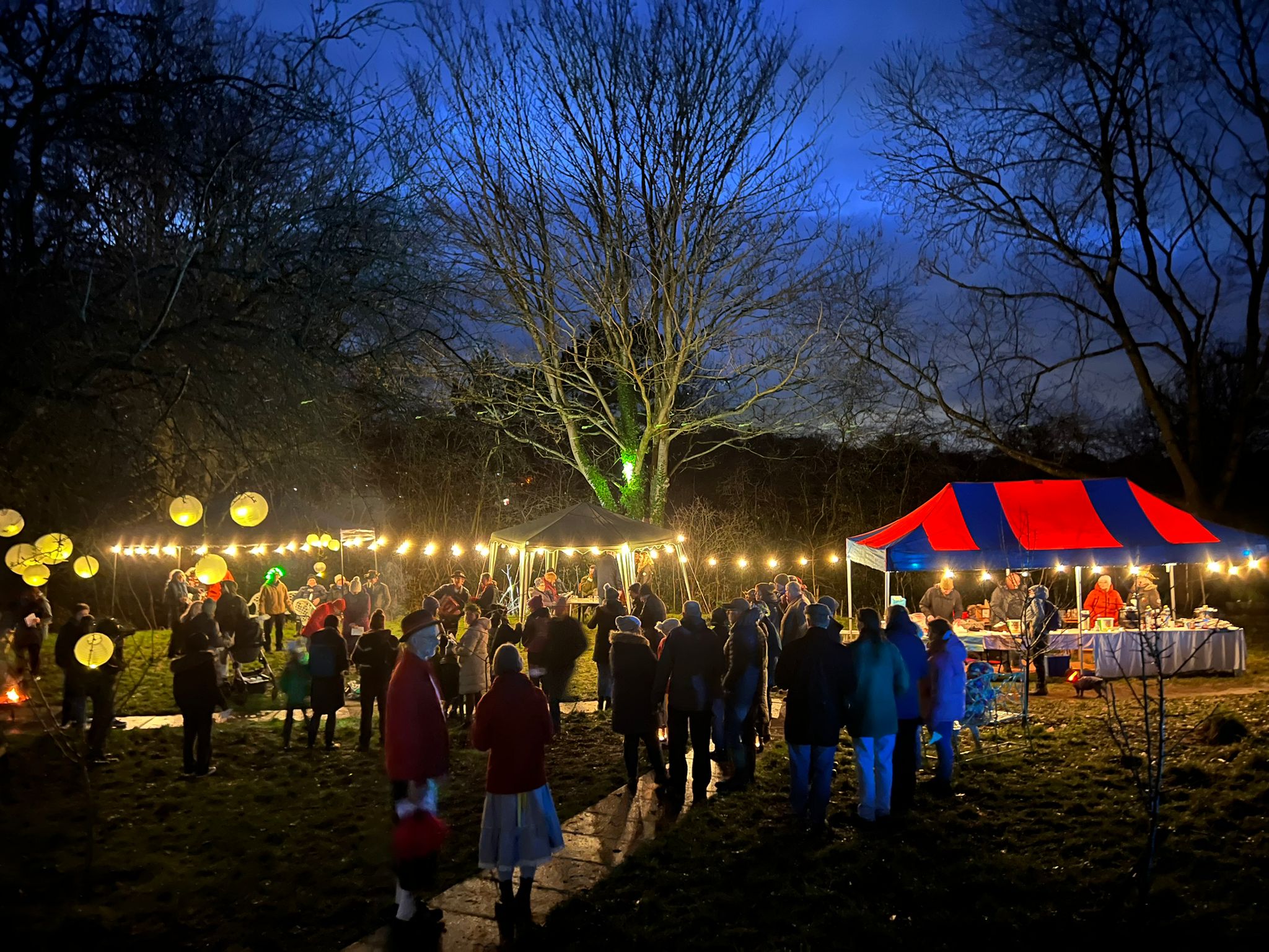 A photo of the 2024 wassail, showing stalls with lights