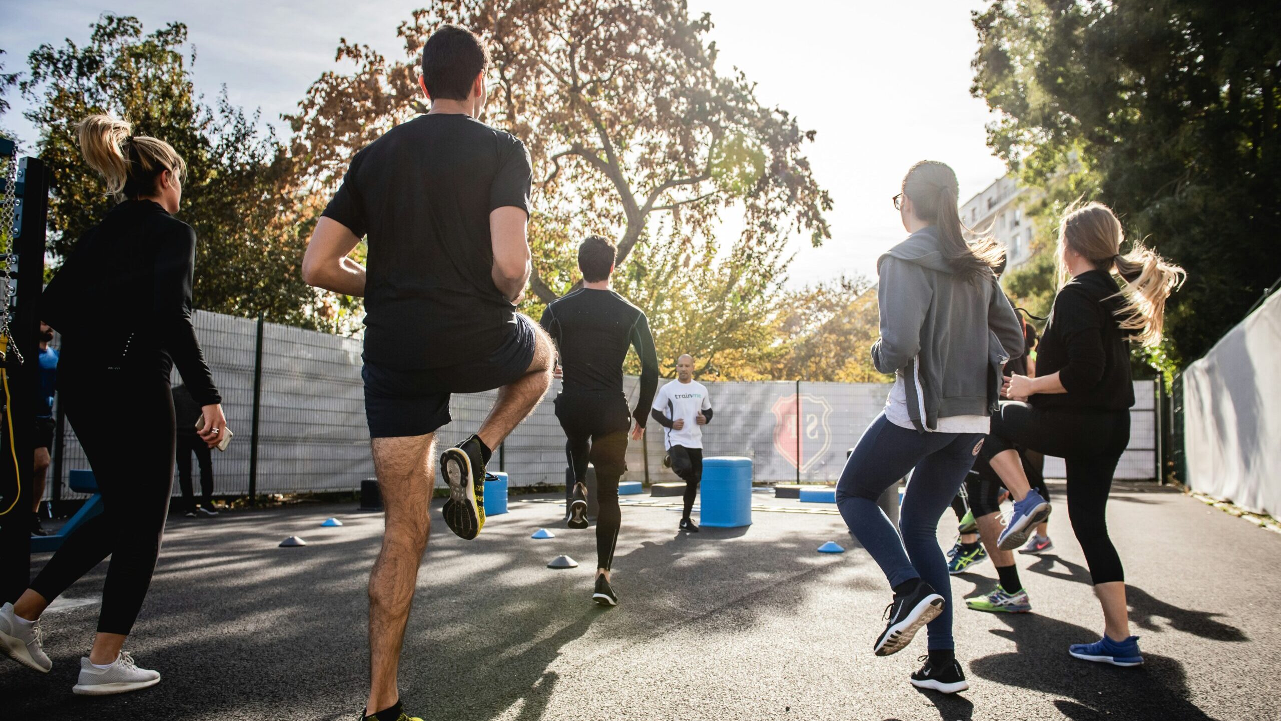 A group of people exercising outdoors